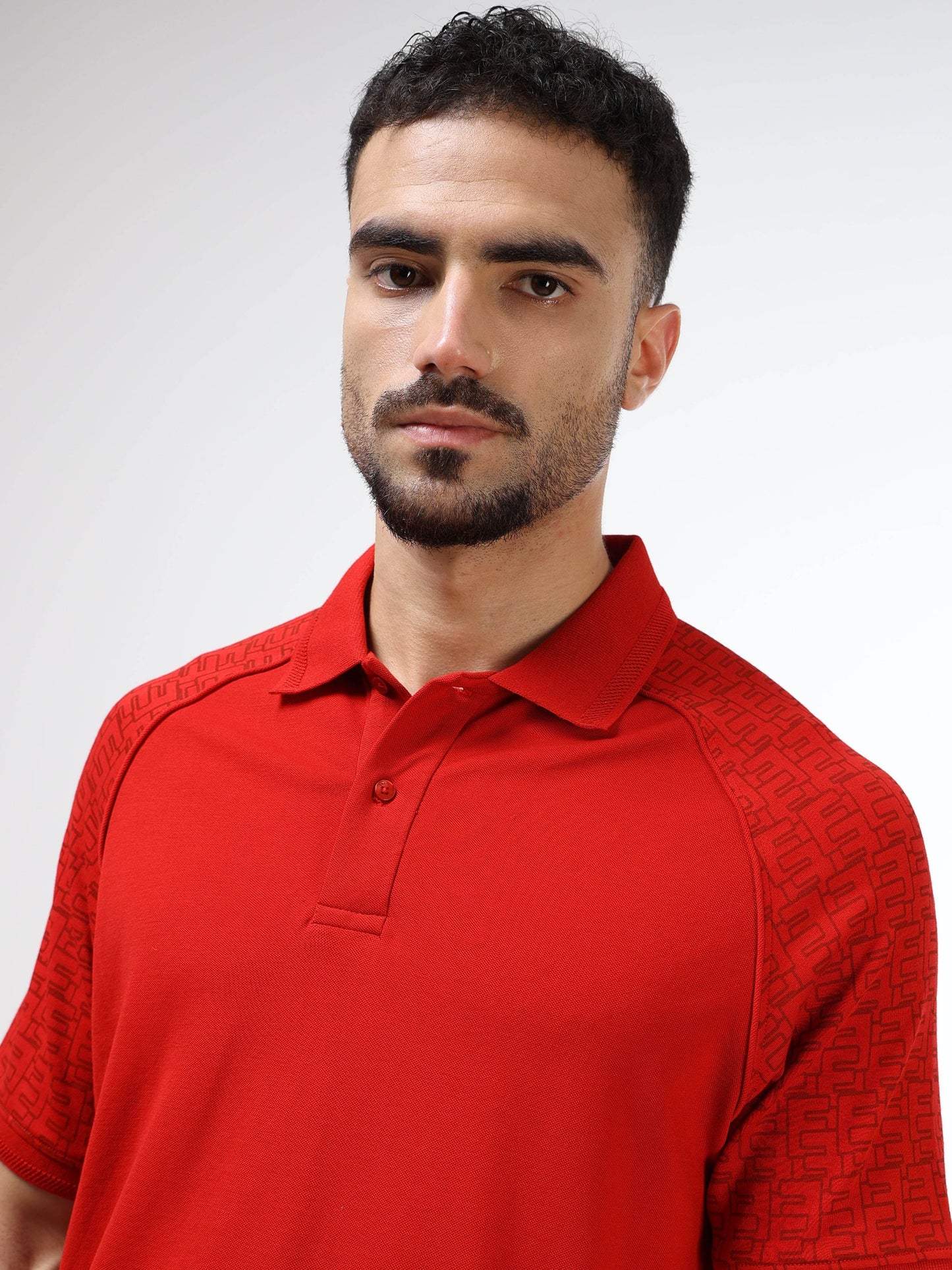 Men's red polo t-shirt with printed raglan sleeves