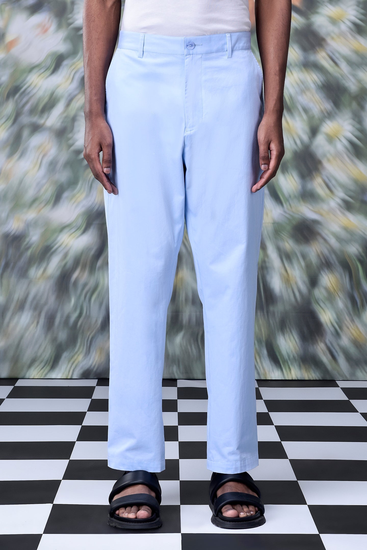 Light blue regular fit men's pants by Stylera styled with black sandals