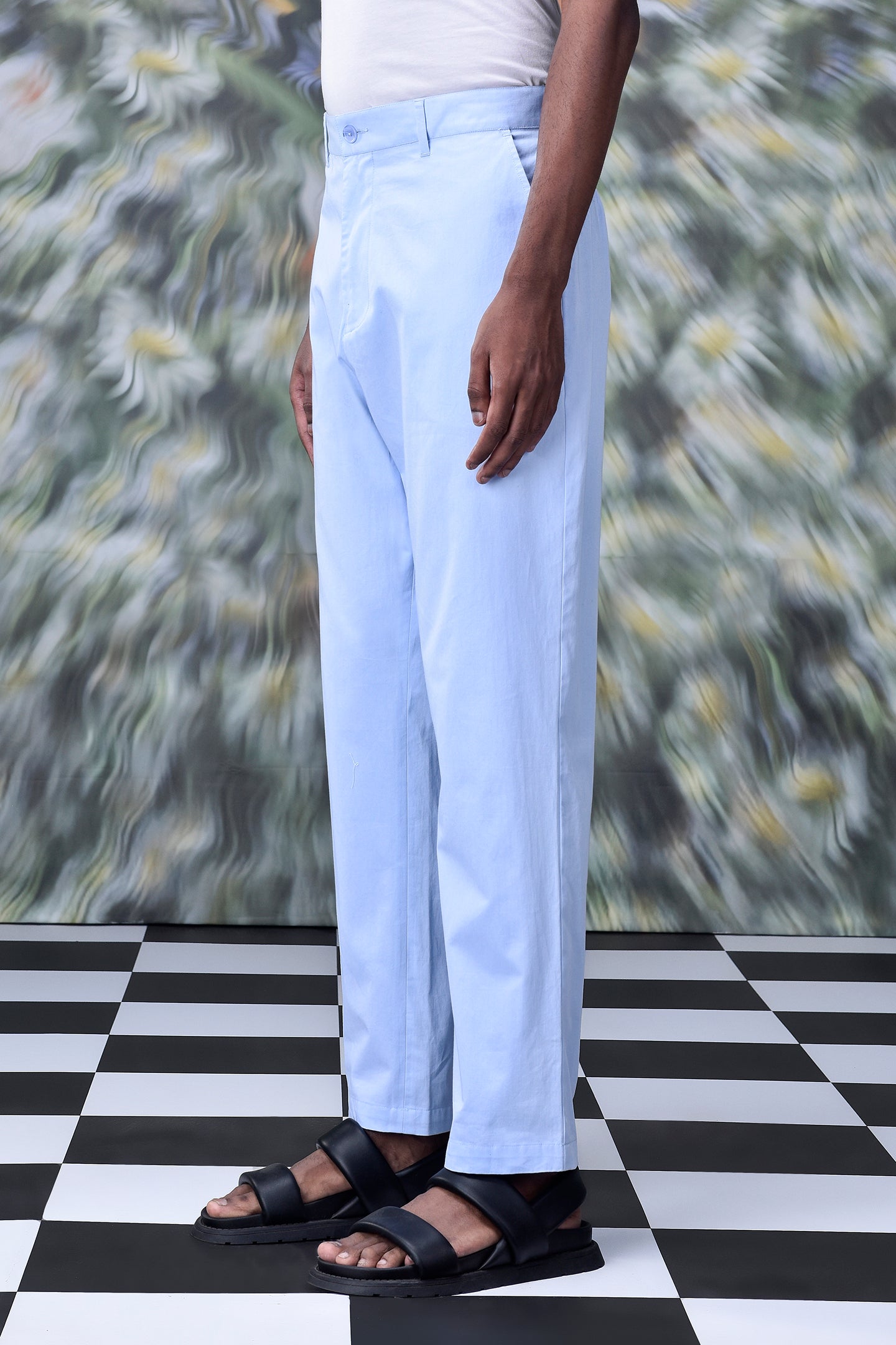 Light blue regular fit men's pants by Stylera worn with black sandals