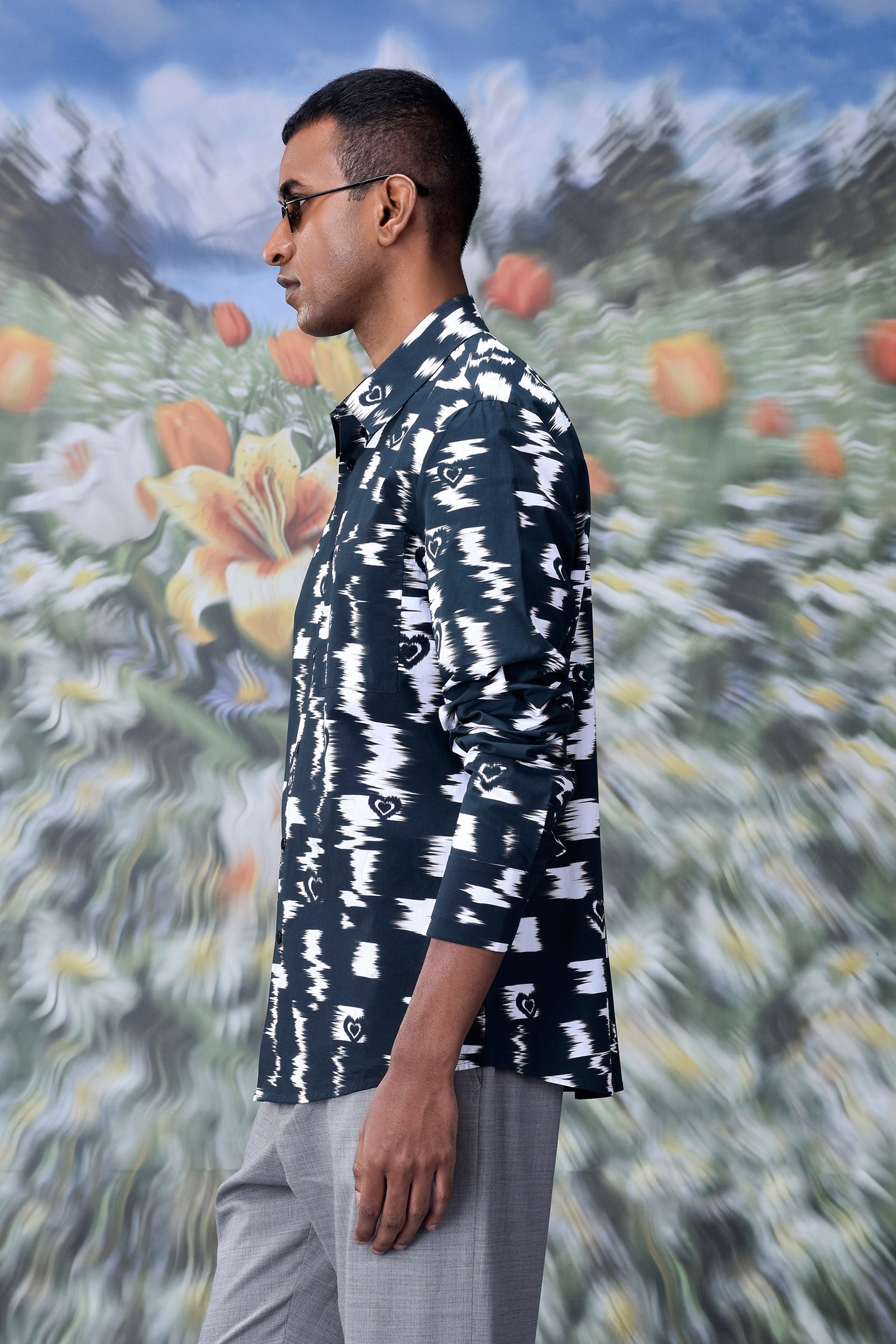 Man wearing trendy printed shirts for men by Stylera with black and white abstract pattern