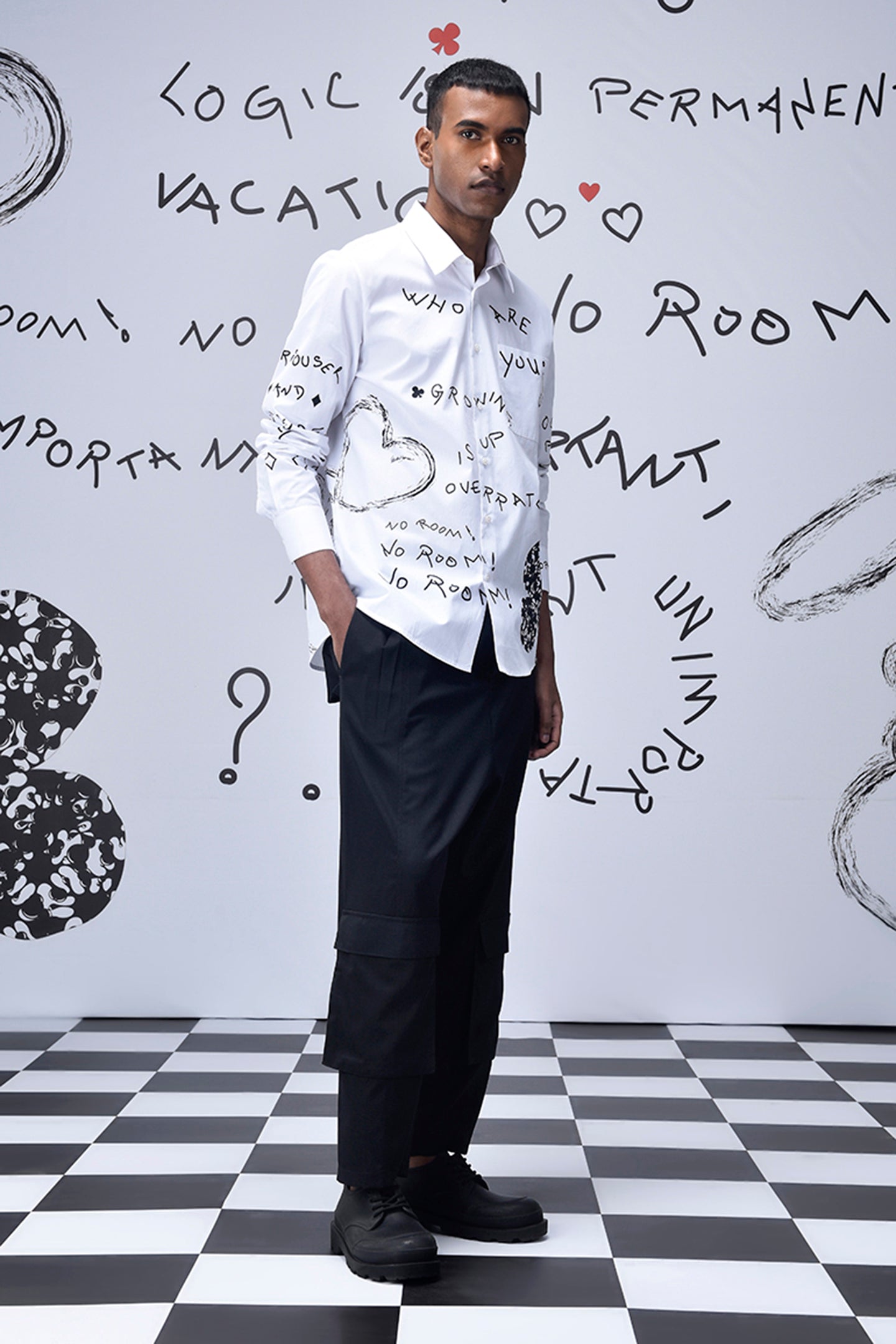 Trendy scribble print shirt by Stylera worn by male model with black pants