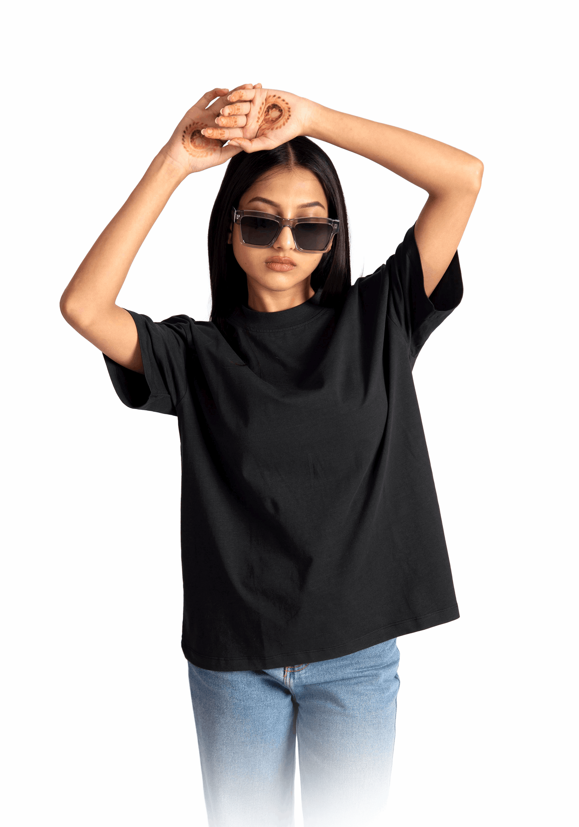women's relaxed fit black tee worn by Stylera with blue jeans and sunglasses