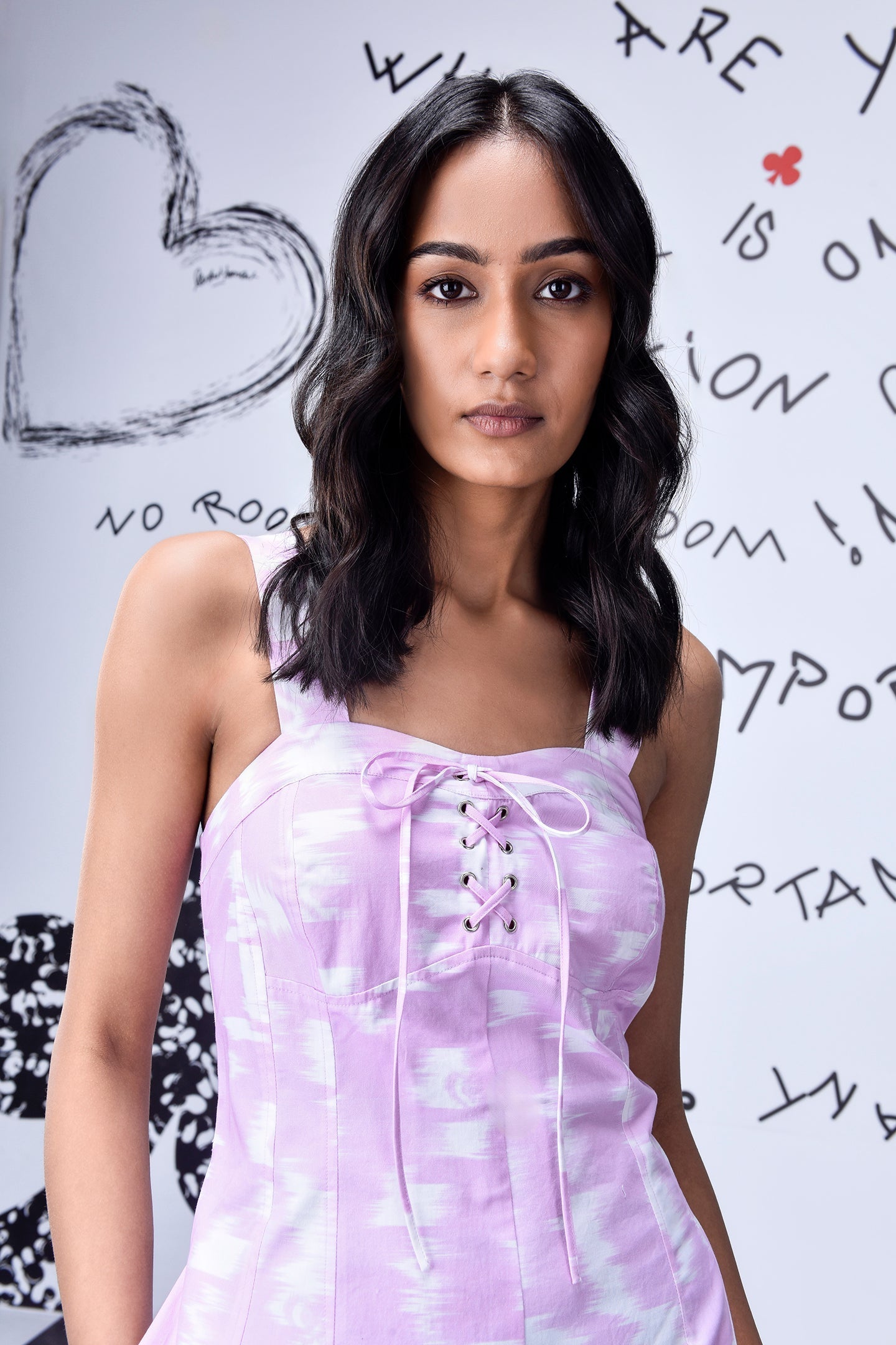 Stylera lilac tie dye lace up women's relaxed fit dungarees with square neckline on model