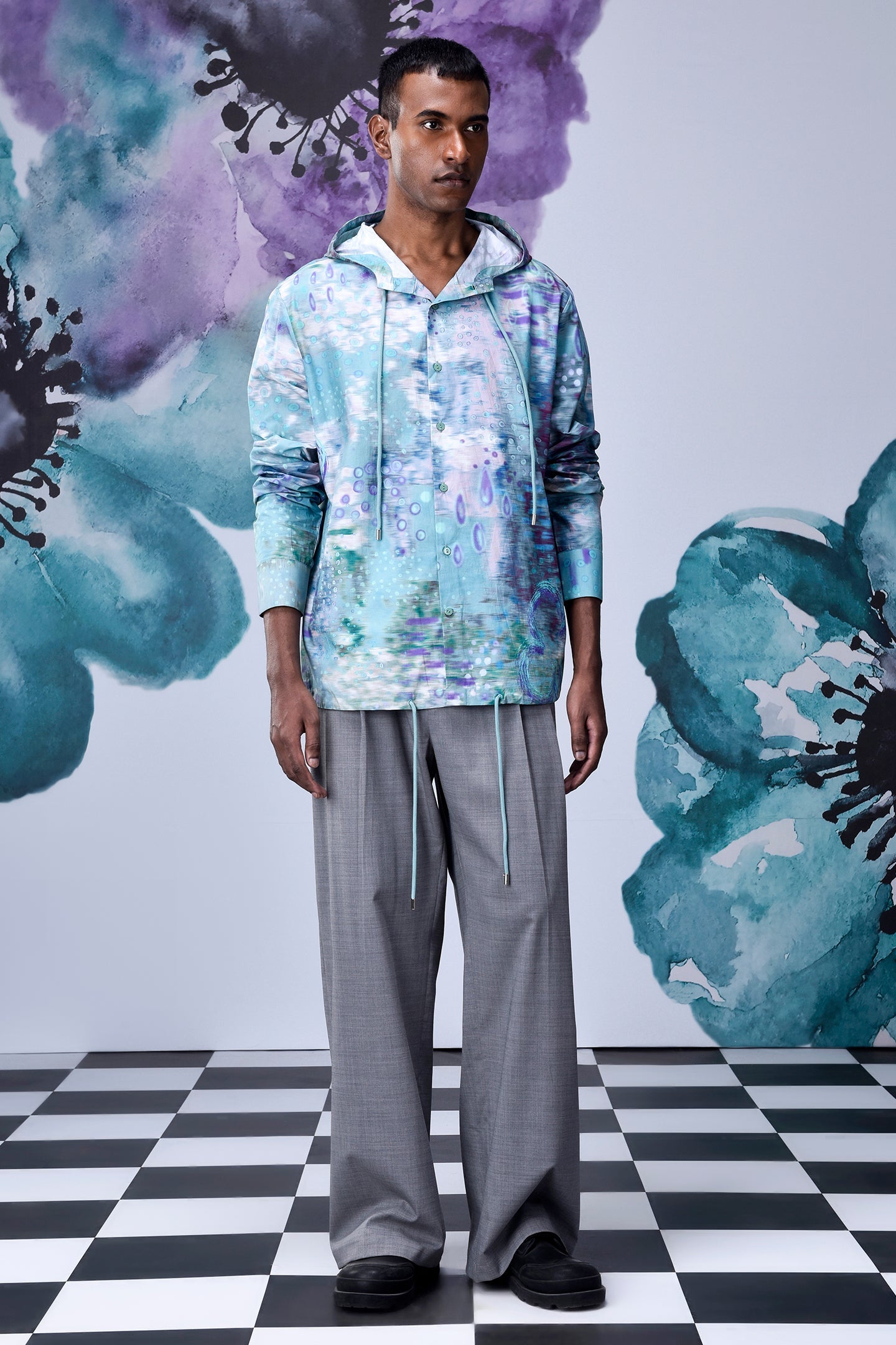 Stylera artistic print hoodie shirt pastel watercolor floral hoodie on male model with gray trousers