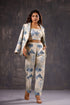 Model wearing Stylera Floral print two piece set for ladies beige crop top high waisted trousers and matching blazer heels