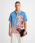 Stylera blue short sleeve shirt with classical painting print beige neck scarf and clutch statement fashion shirt