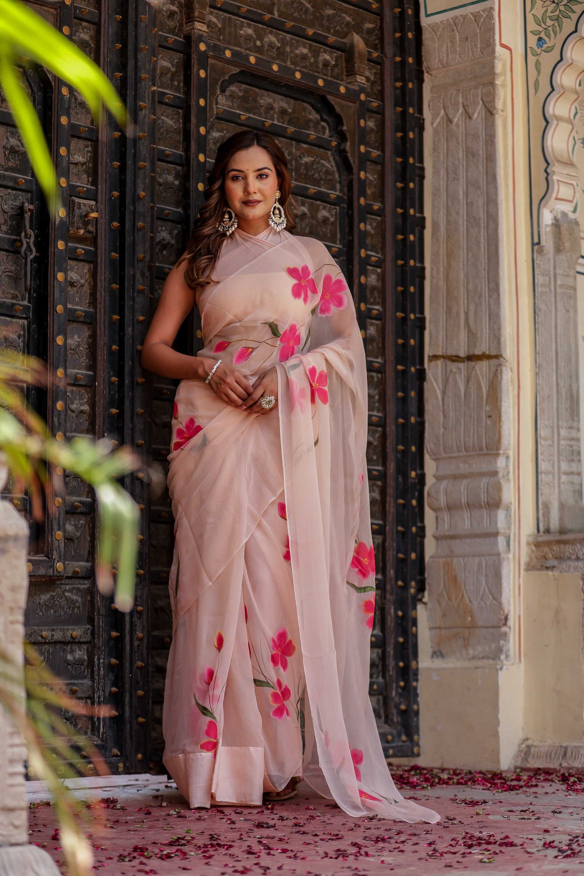 Elegant beige floral chiffon saree featuring pink flower embroidery perfect for festive occasions