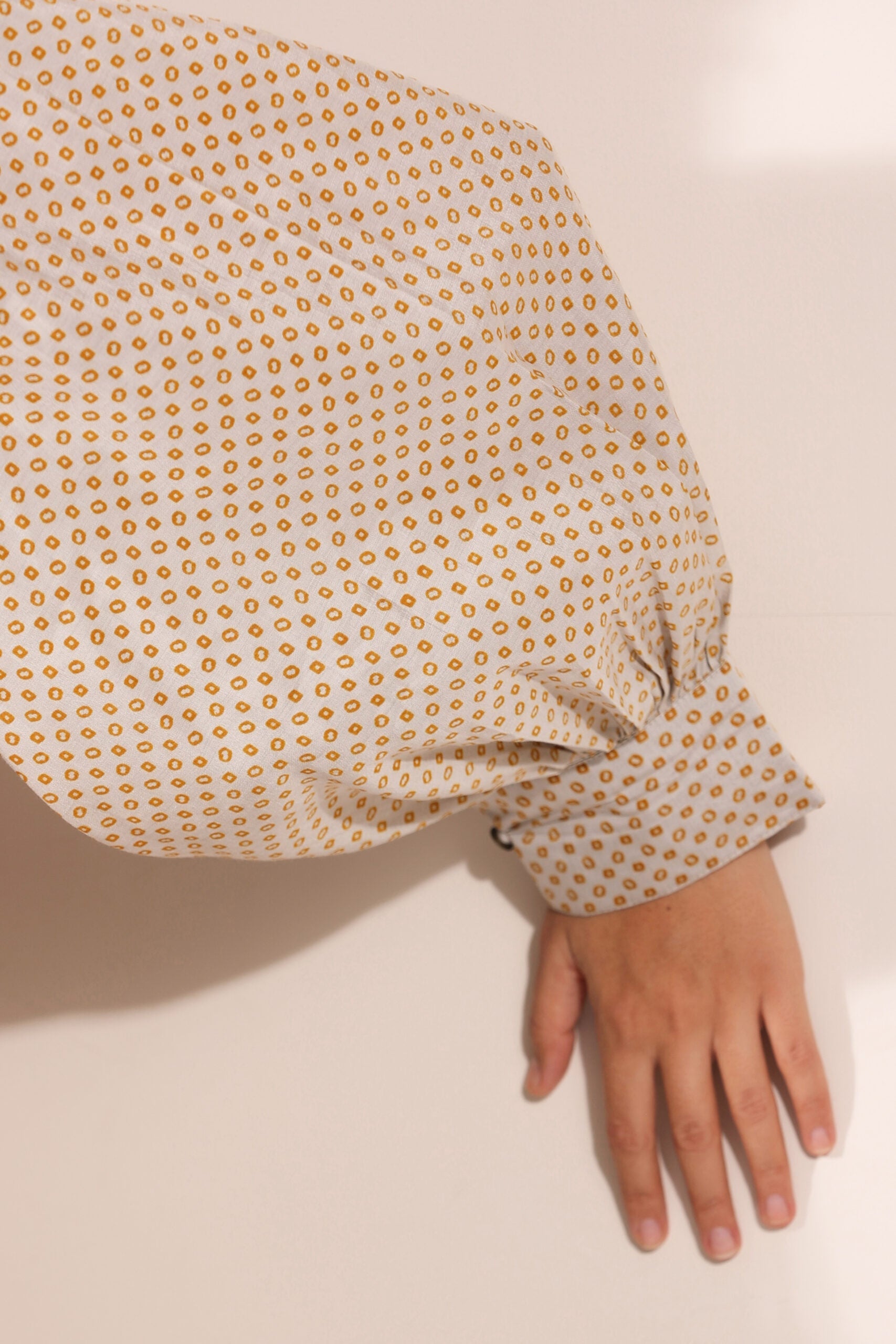 Close-up of Stylera Bindu Starlight co-ord set featuring a patterned sleeve design