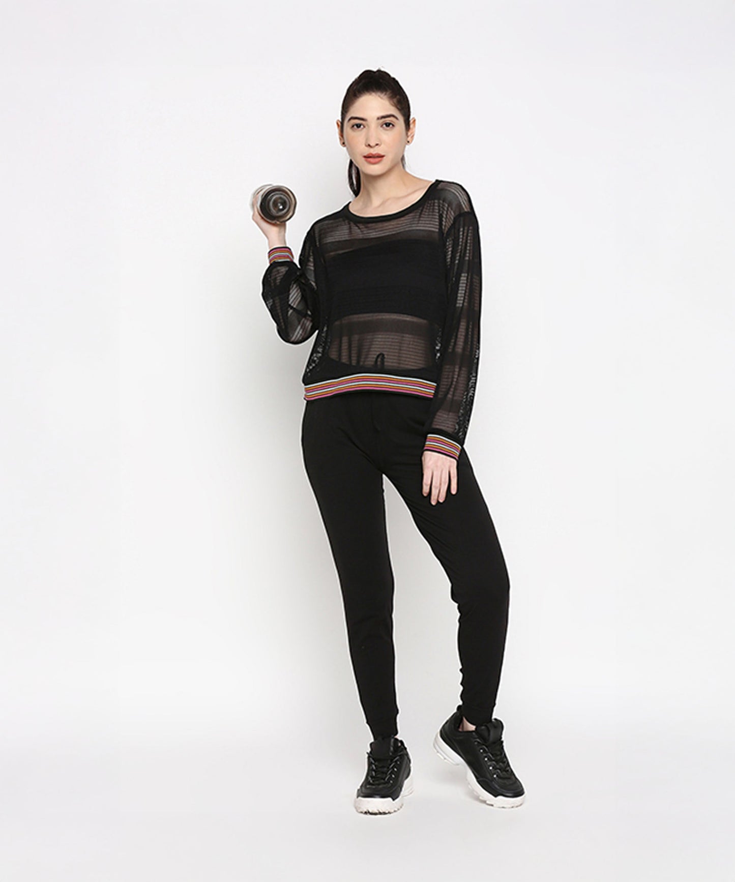 Stylish black netted top for women paired with black joggers, perfect for activewear outfits