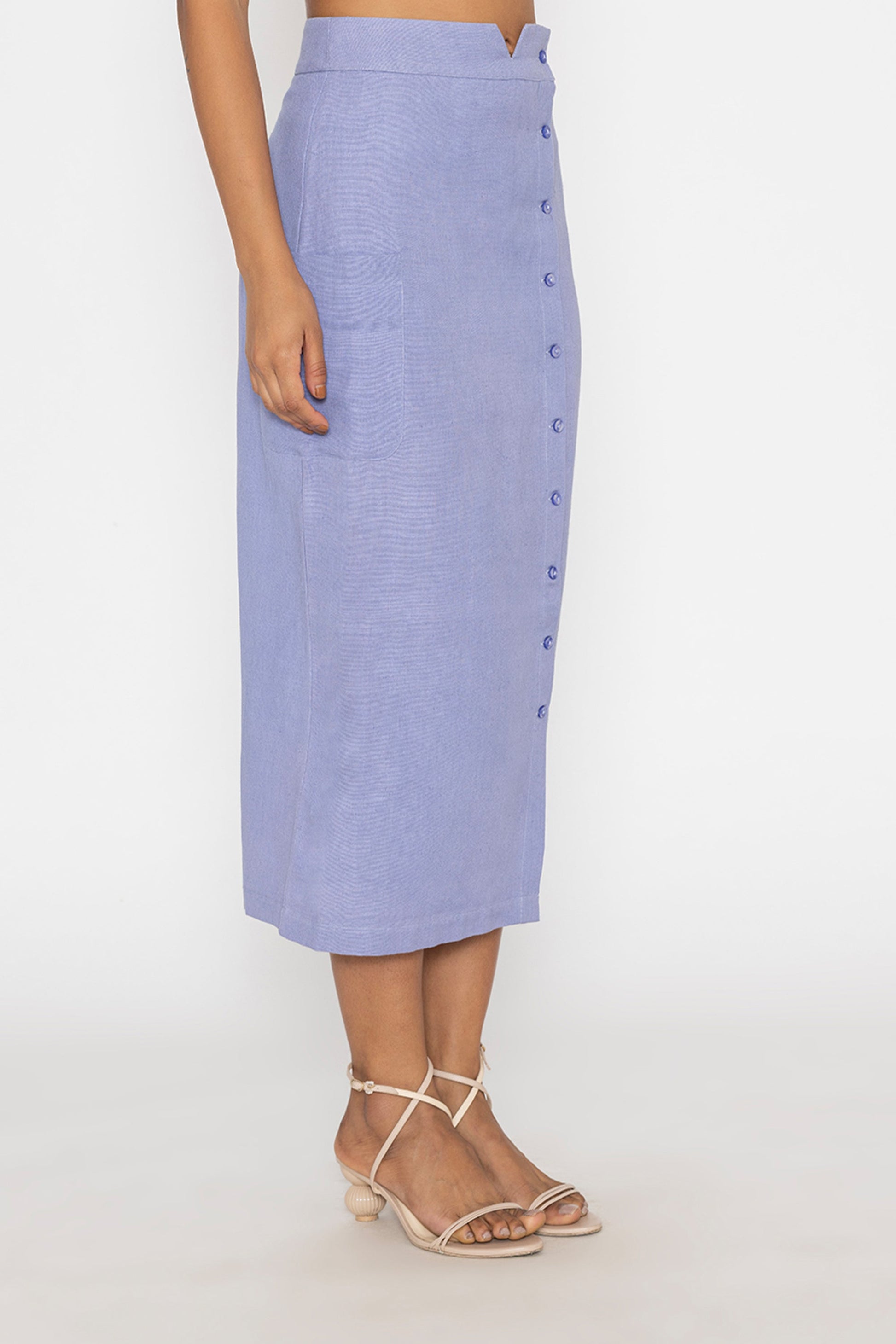 Stylera blue button front midi skirt worn with strappy sandals on model