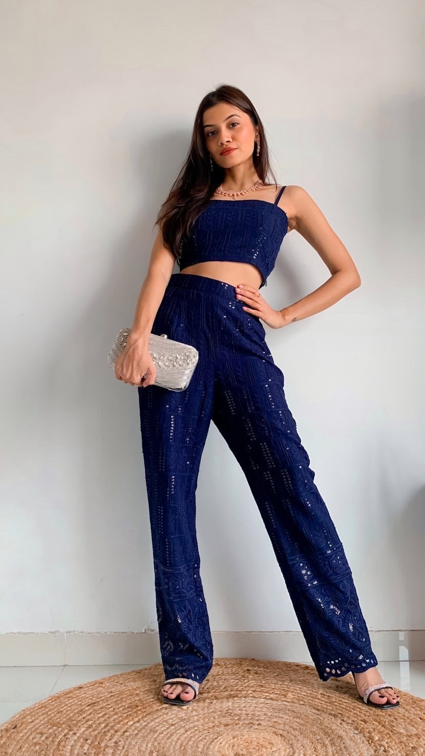 Stylera Model wearing blue chikankari crop top with spaghetti straps and matching sequin palazzo pants