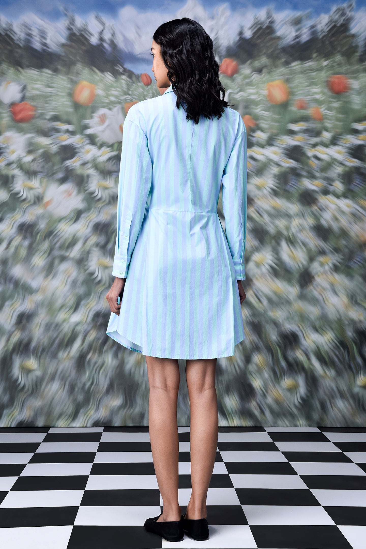 Back view of model in Stylera blue green stripe dress long sleeve belted shirt dress