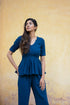 Model wearing a Yale blue peplum co-ord set with a stylish design and relaxed fit