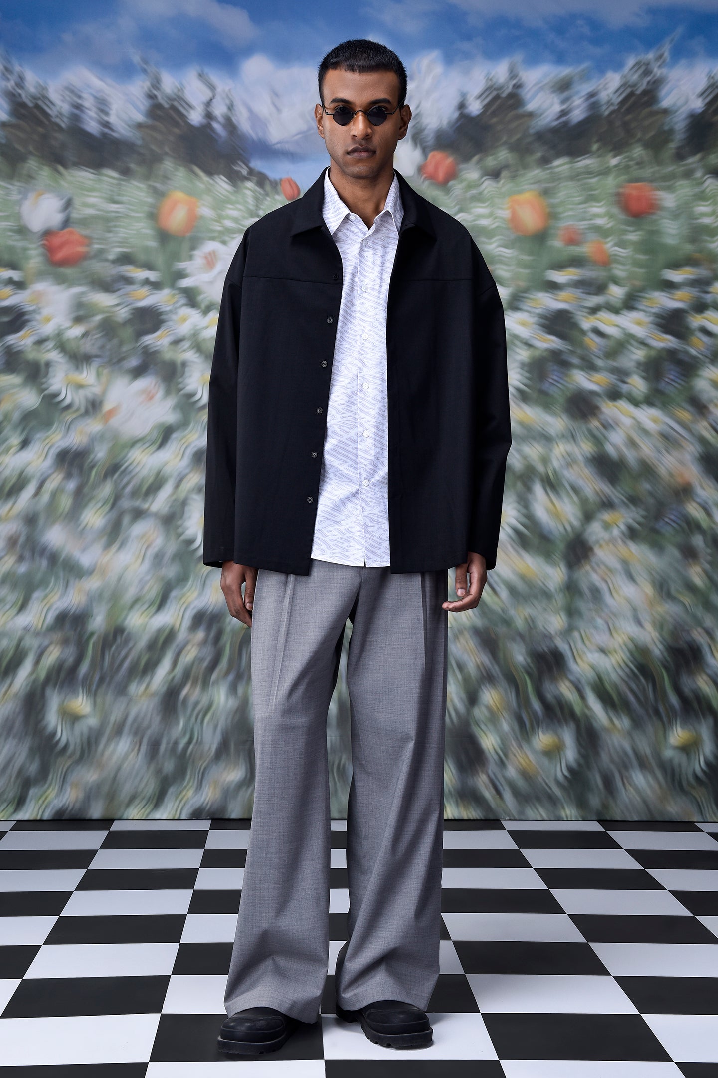 Men's oversized shacket for men in black by Stylera styled with gray pants and white shirt