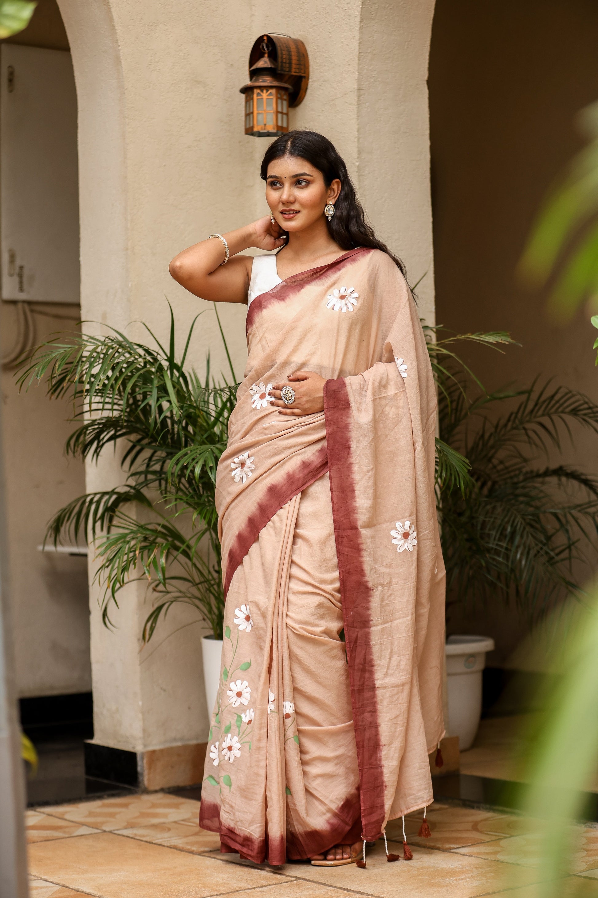 Elegant Stylera malmal saree with designer border in soft beige and floral embroidery. Perfect for special occasions.