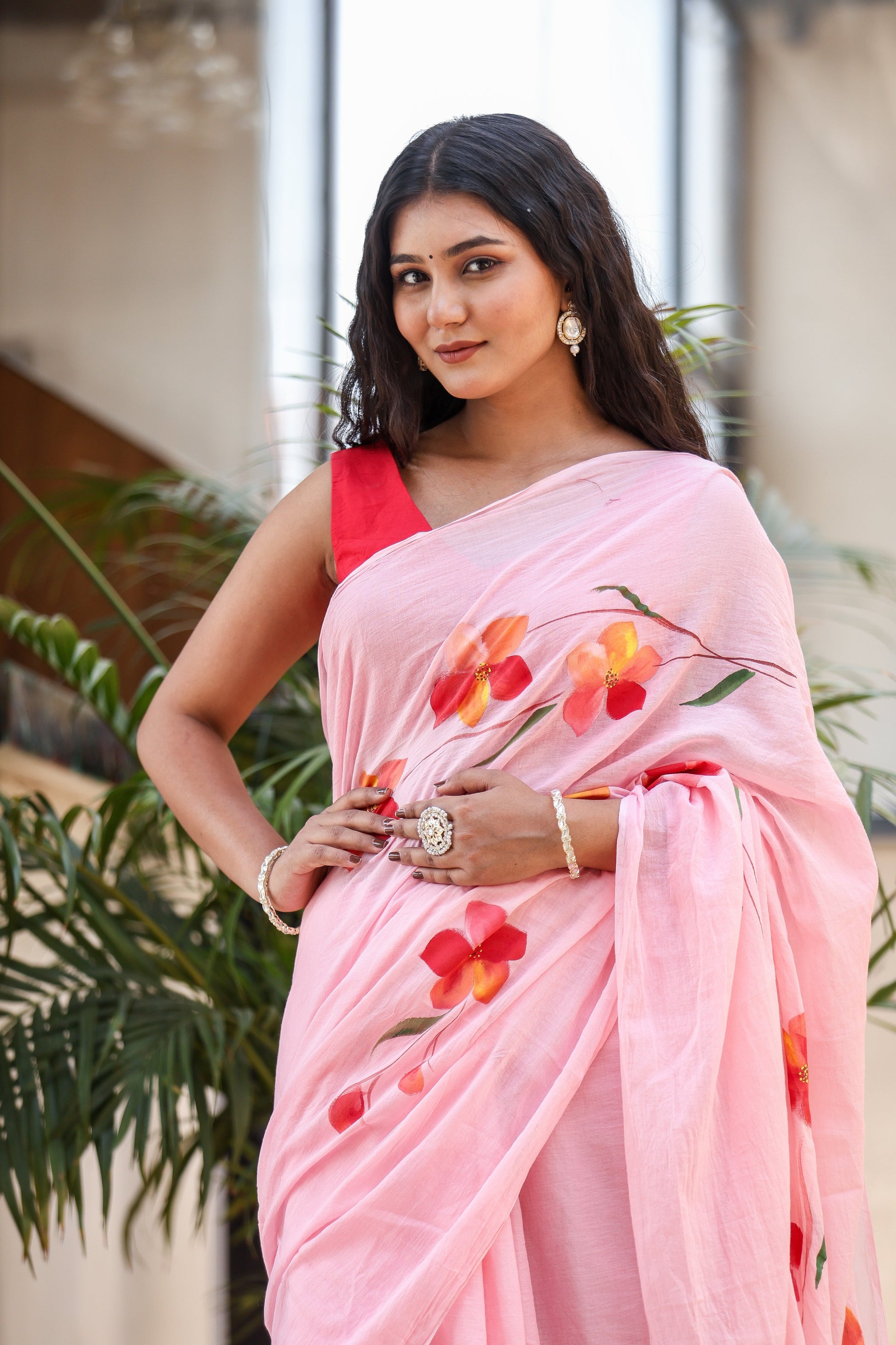Buy trendy malmal saree in soft pink with floral designs, perfect for elegant occasions