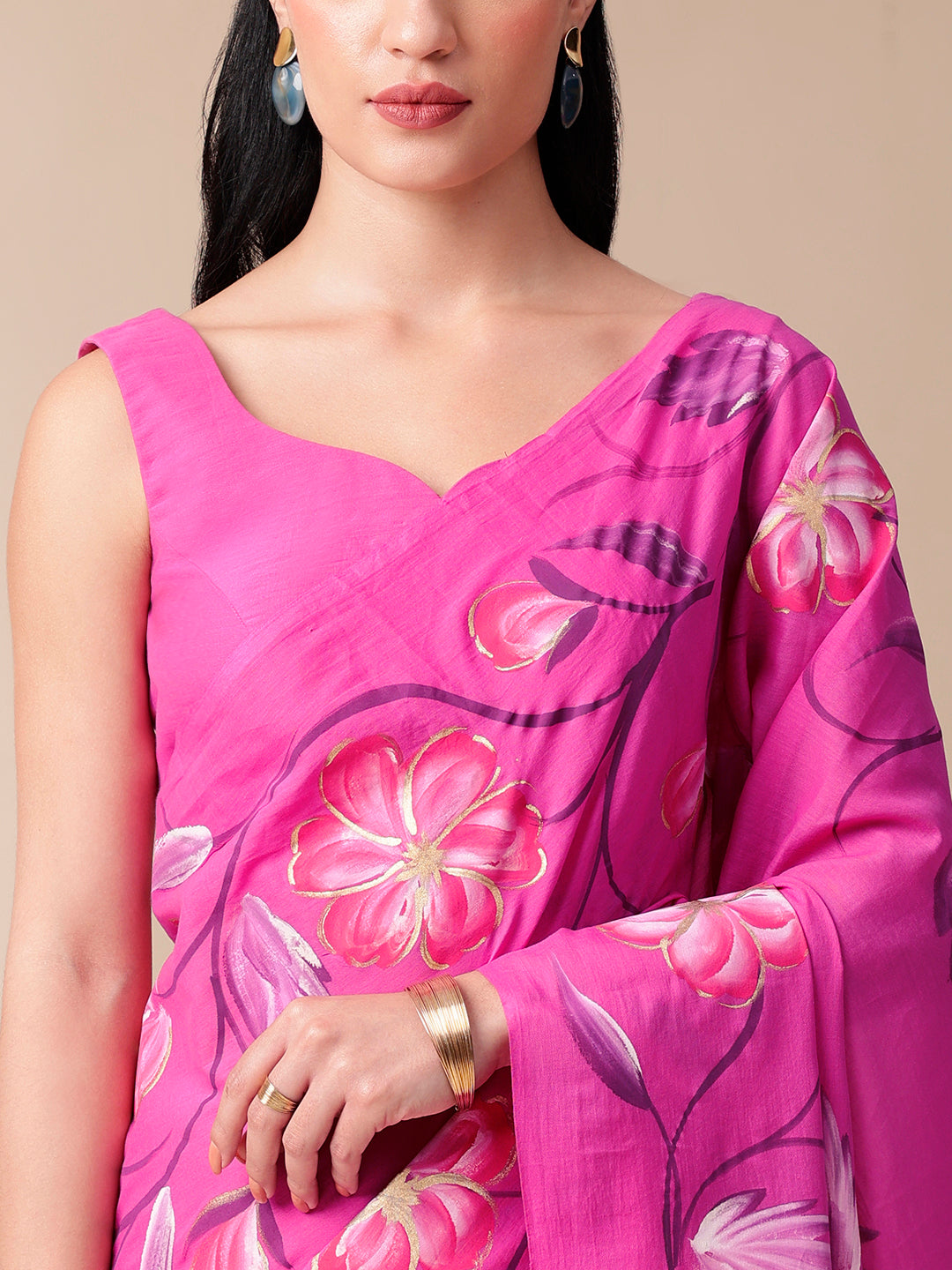 Calm Canvas floral saree in vibrant pink with floral designs, perfect for festive occasions