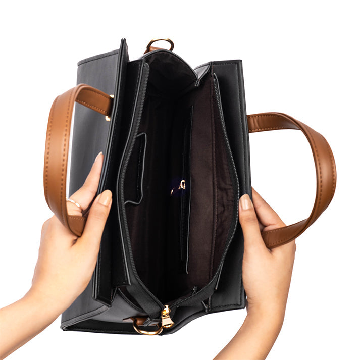 Inside view of a charcoal caramel handbag with spacious compartments and stylish design