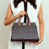 Stylish charcoal caramel handbag by Stylera with elegant detailing and sturdy handles