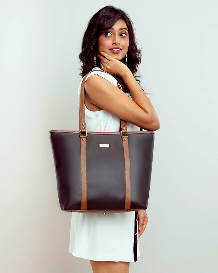 Stylish charcoal caramel tote bag with sturdy straps and sleek design for everyday use