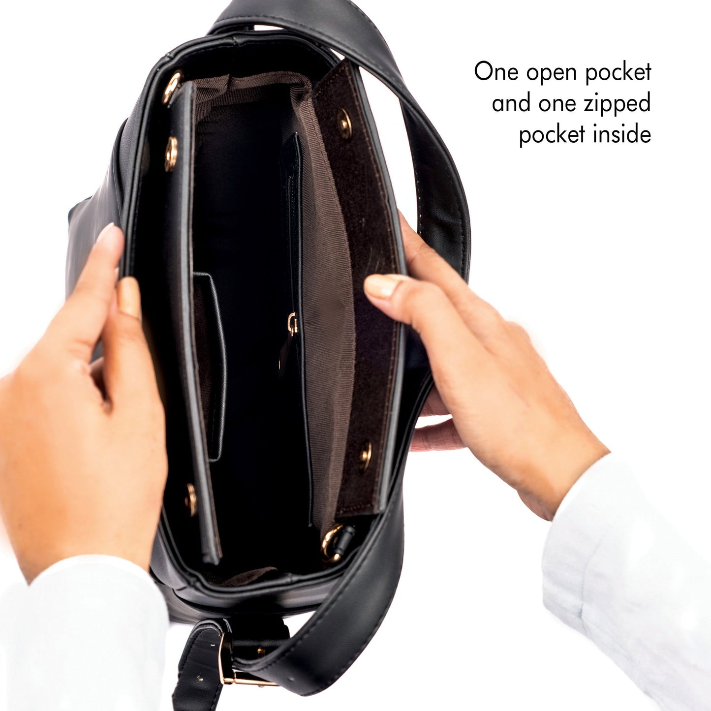 Interior of charcoal chic bucket bag showing one open pocket and one zipped pocket for organization