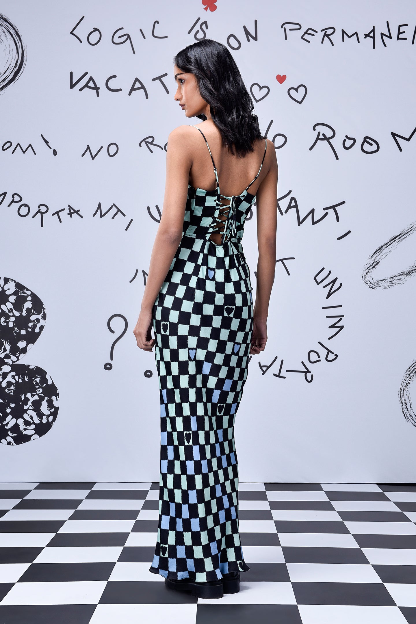 Stylera chess board cowl neck dress back view lace up straps fitted floor length gown