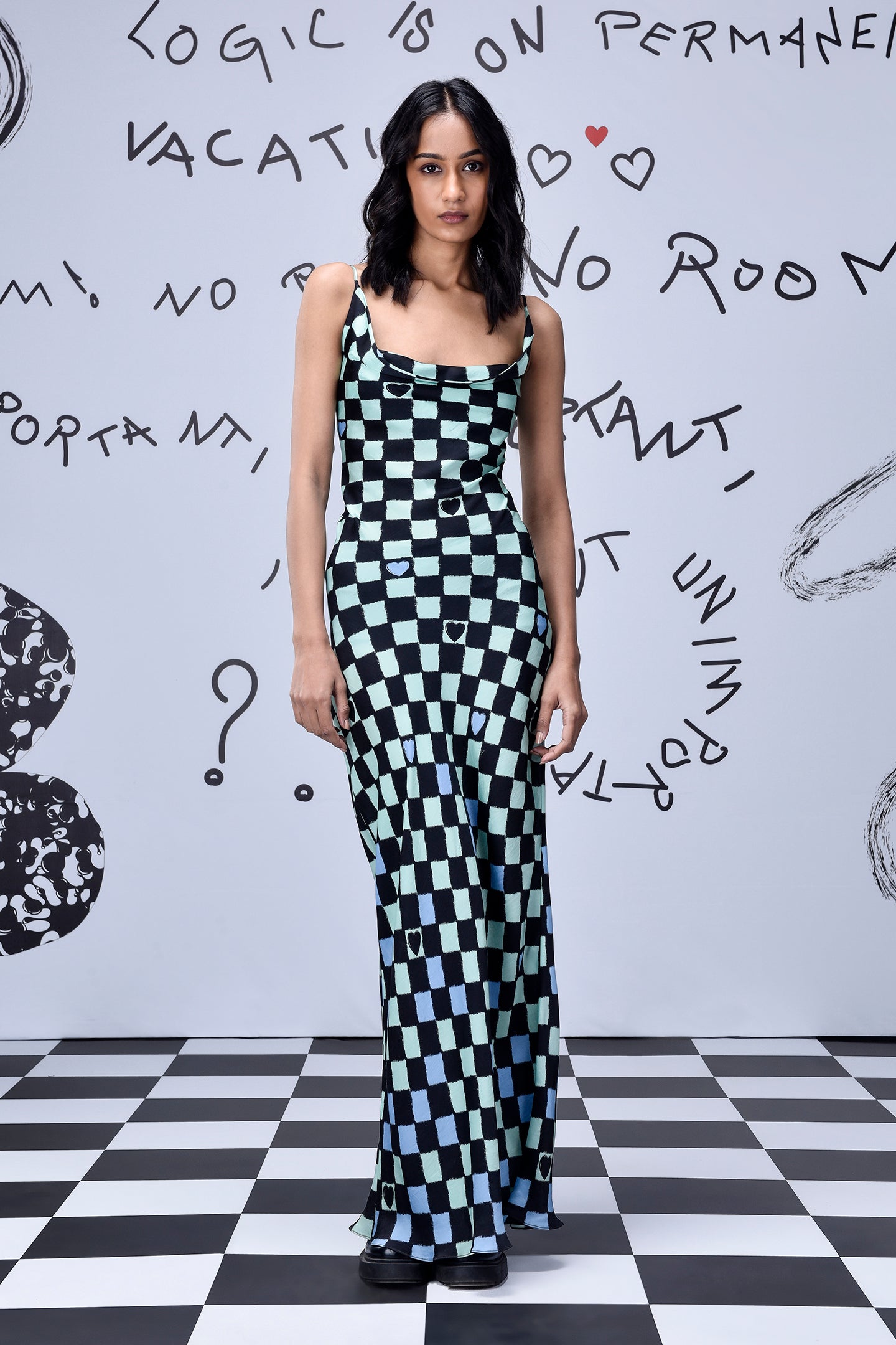 Stylera chess board cowl neck dress mint and black checkerboard maxi on a model