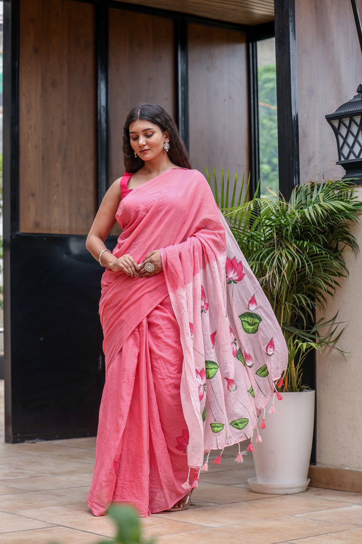 Elegant pink cotton malmal saree with blouse featuring floral motifs for a stylish look