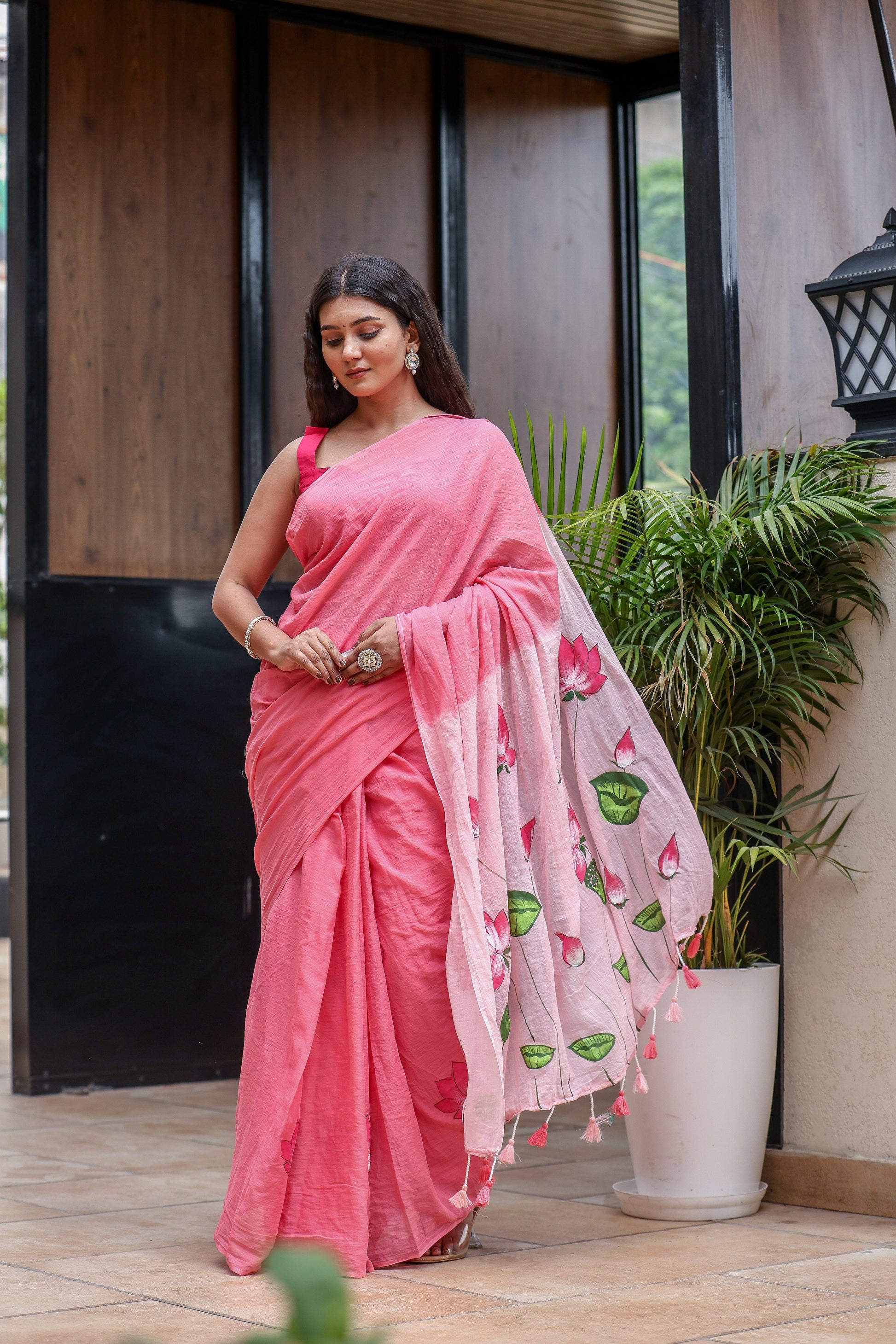 Elegant pink cotton malmal saree with blouse featuring floral motifs for a stylish look