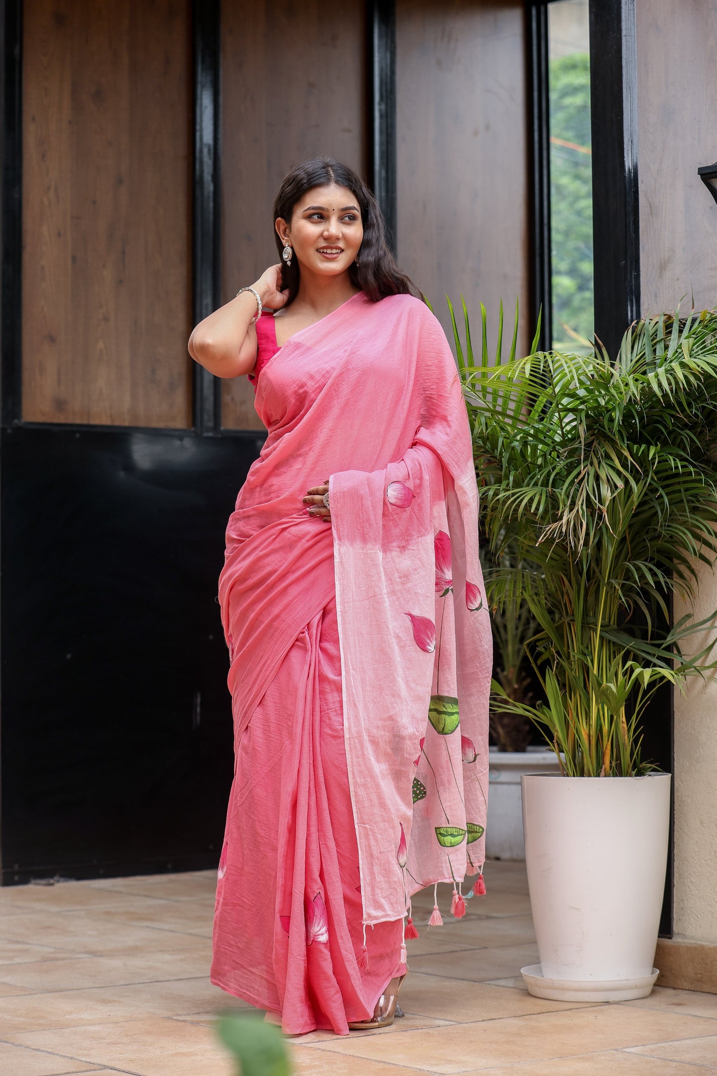 Beautiful pink cotton malmal saree with blouse featuring elegant embroidery and tassels