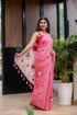 Elegant pink cotton malmal saree with blouse featuring floral prints and tassels for festive occasions