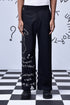 Designer black wool trousers by Stylera with white graphic text on one leg
