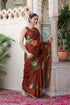 Elegant designer brown saree for wedding featuring floral embroidery, worn by a model in a festive setting