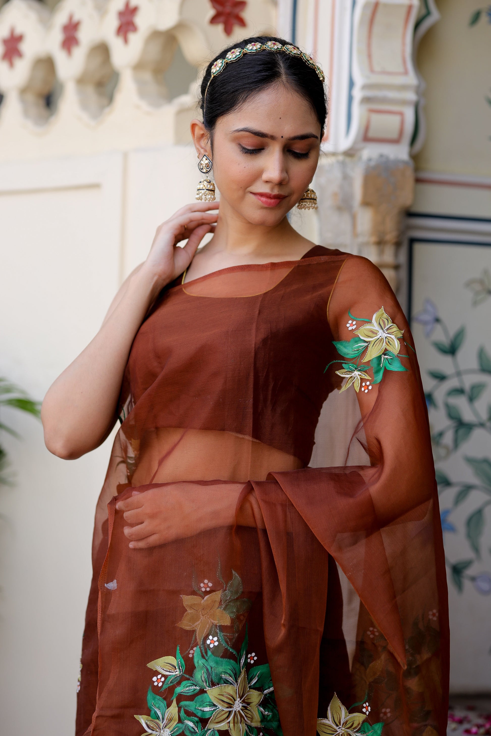 Elegant designer brown saree for wedding with floral embroidery and sheer drape by Stylera