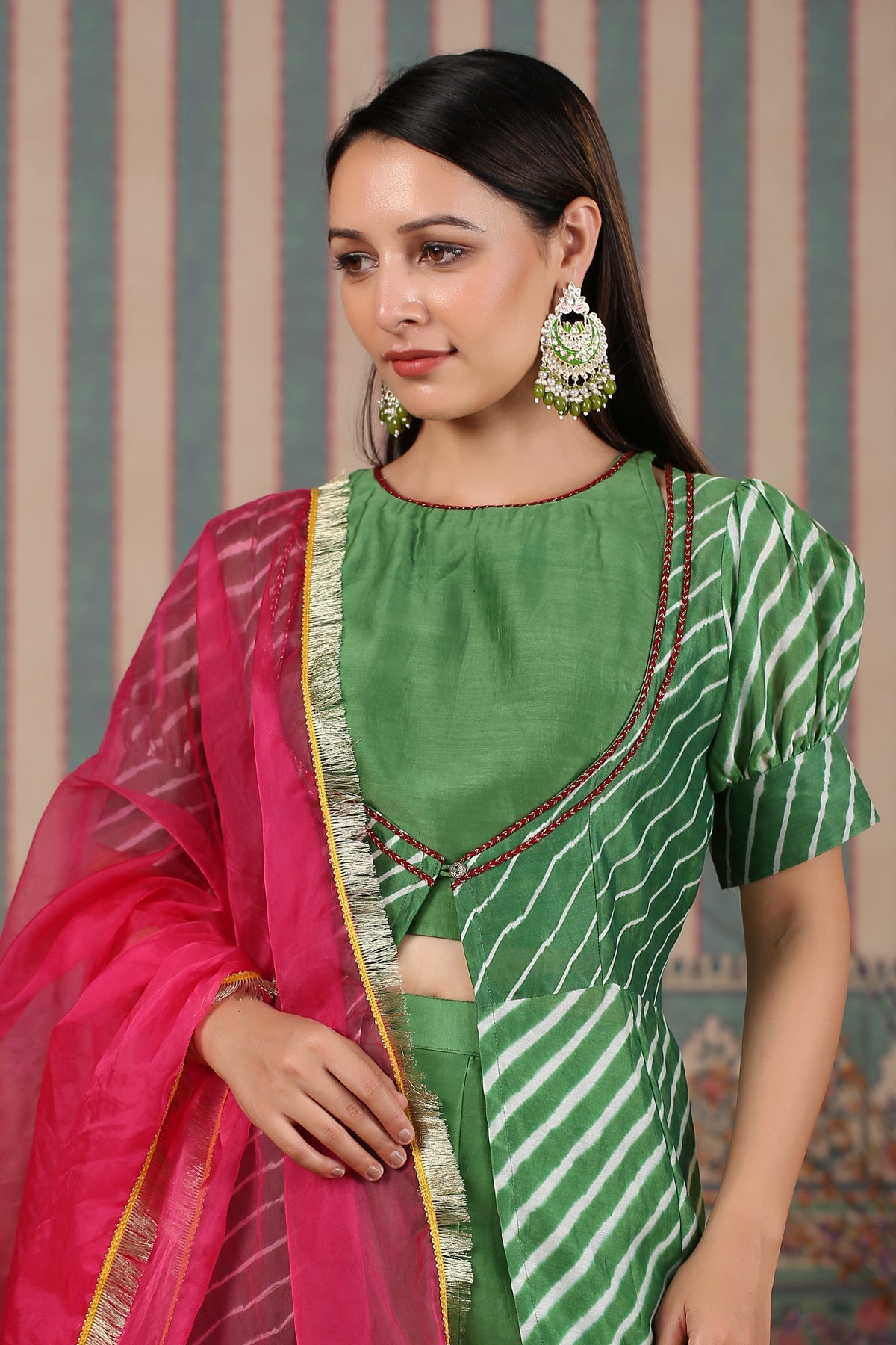 Elegant designer lehriya dress for women in green with stylish puff sleeves and pink dupatta
