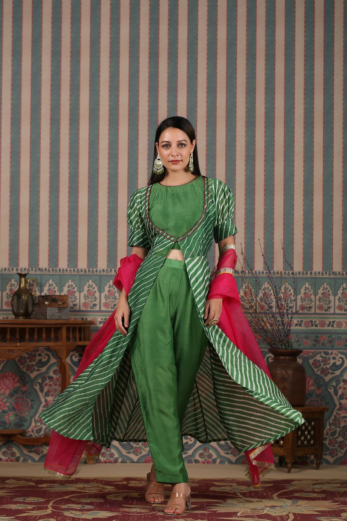 Stylish green designer lehriya dress for women with pink dupatta and modern silhouette