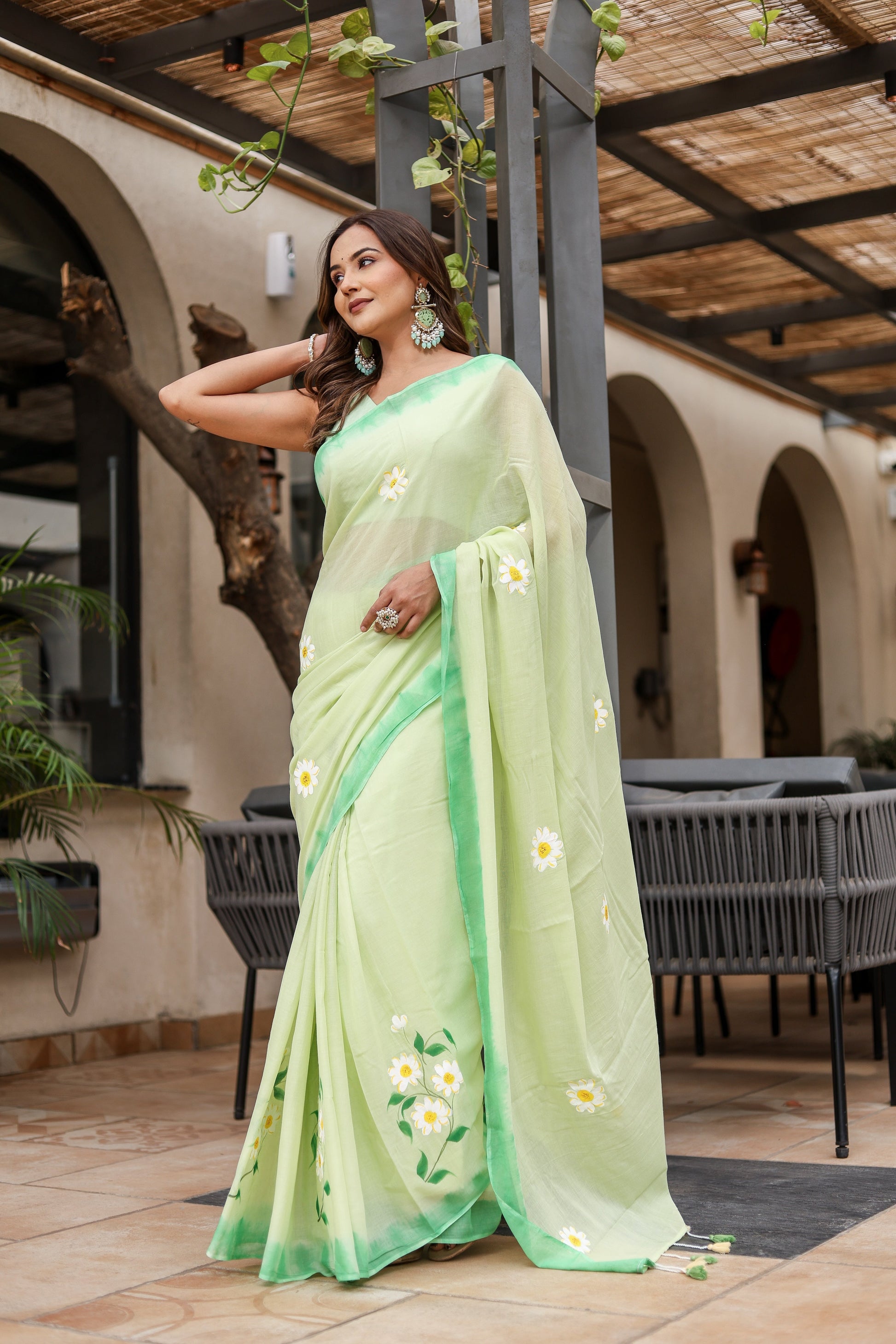 Elegant Stylera designer malmal saree with flowers in light green featuring beautiful floral embroidery
