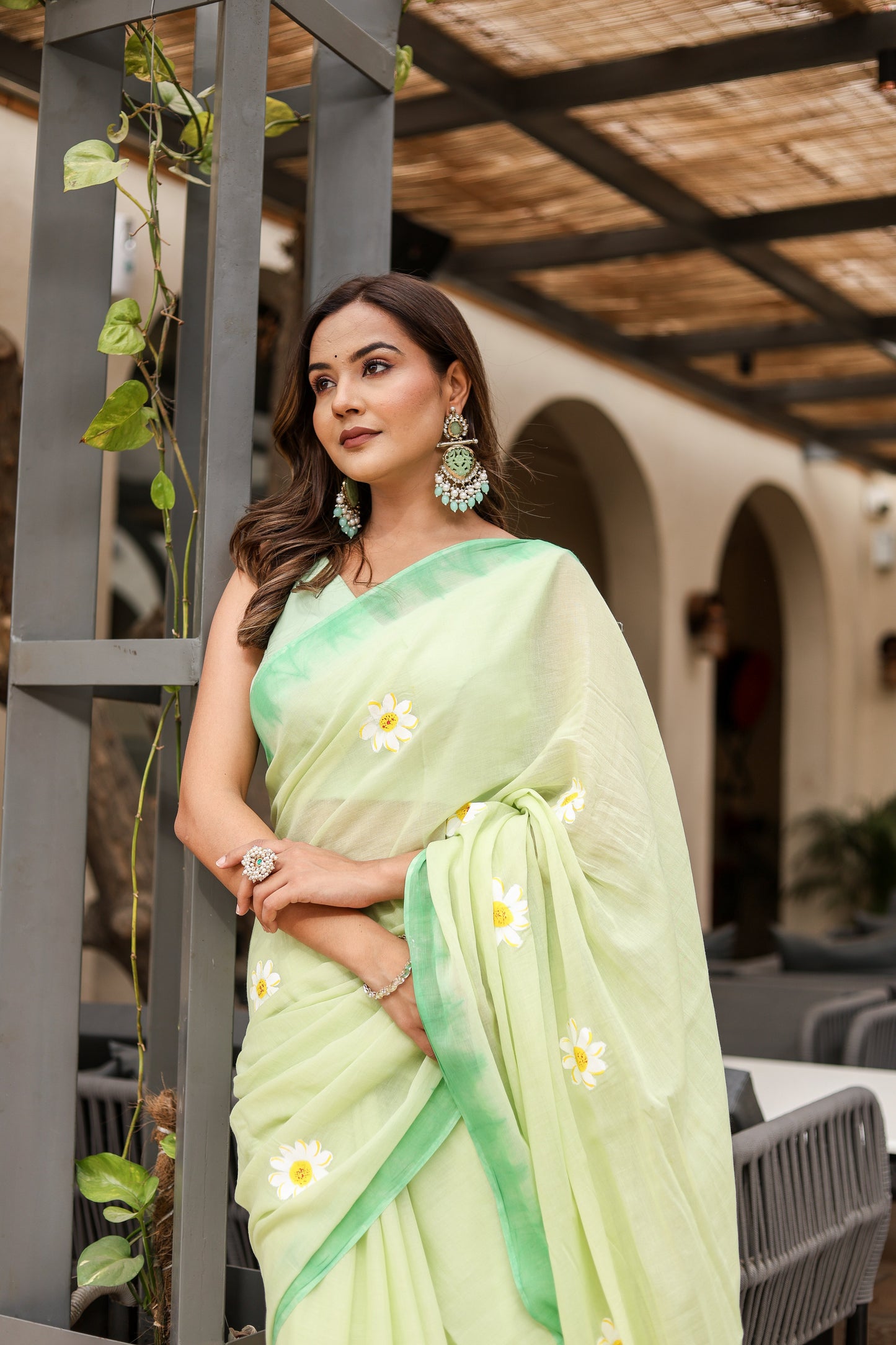 Elegant Stylera designer malmal saree with flowers in soft green, perfect for festive occasions