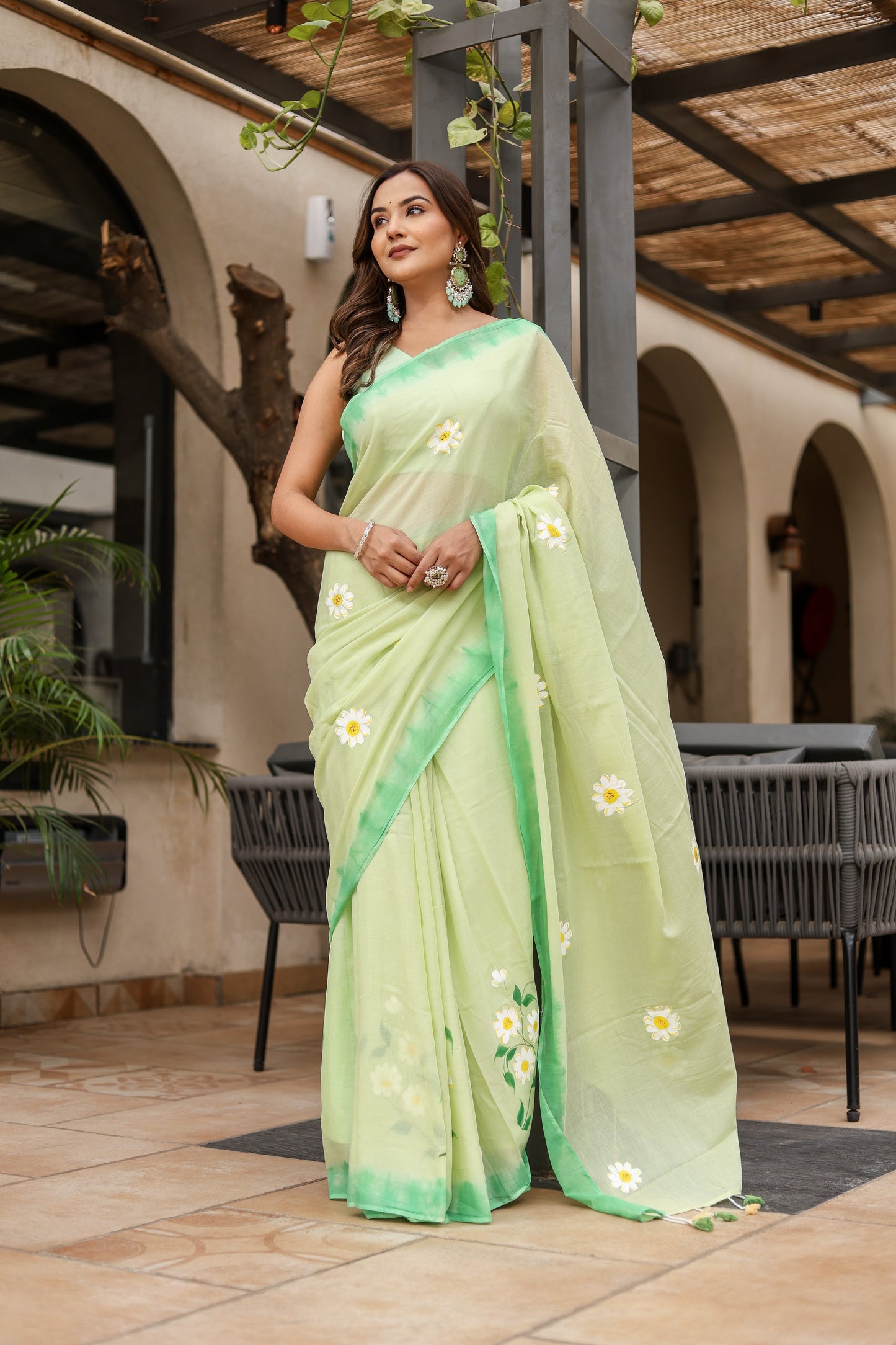 Elegant Stylera designer malmal saree with flowers in light green for stylish occasions