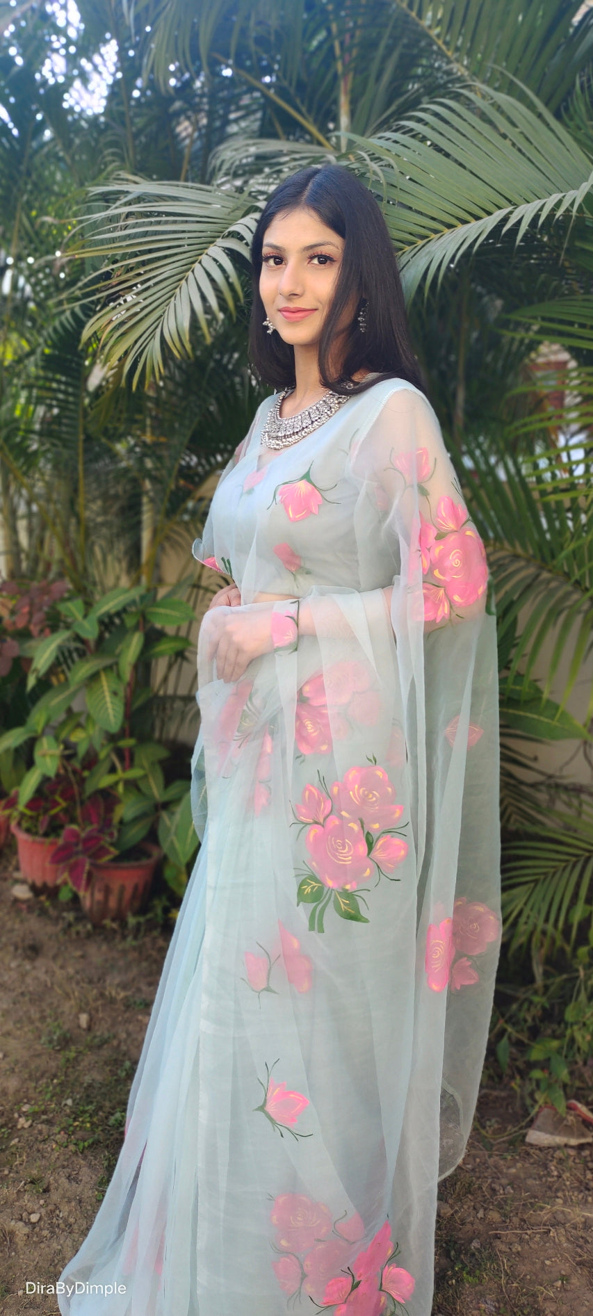Elegant designer party wear organza saree adorned with floral embroidery for festive occasions