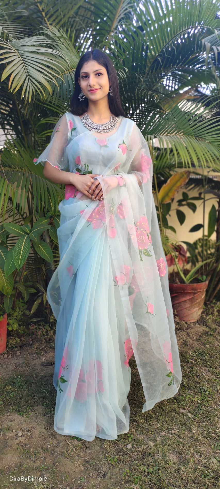 Elegant DiraByDimple designer party wear organza saree with floral prints, perfect for special occasions