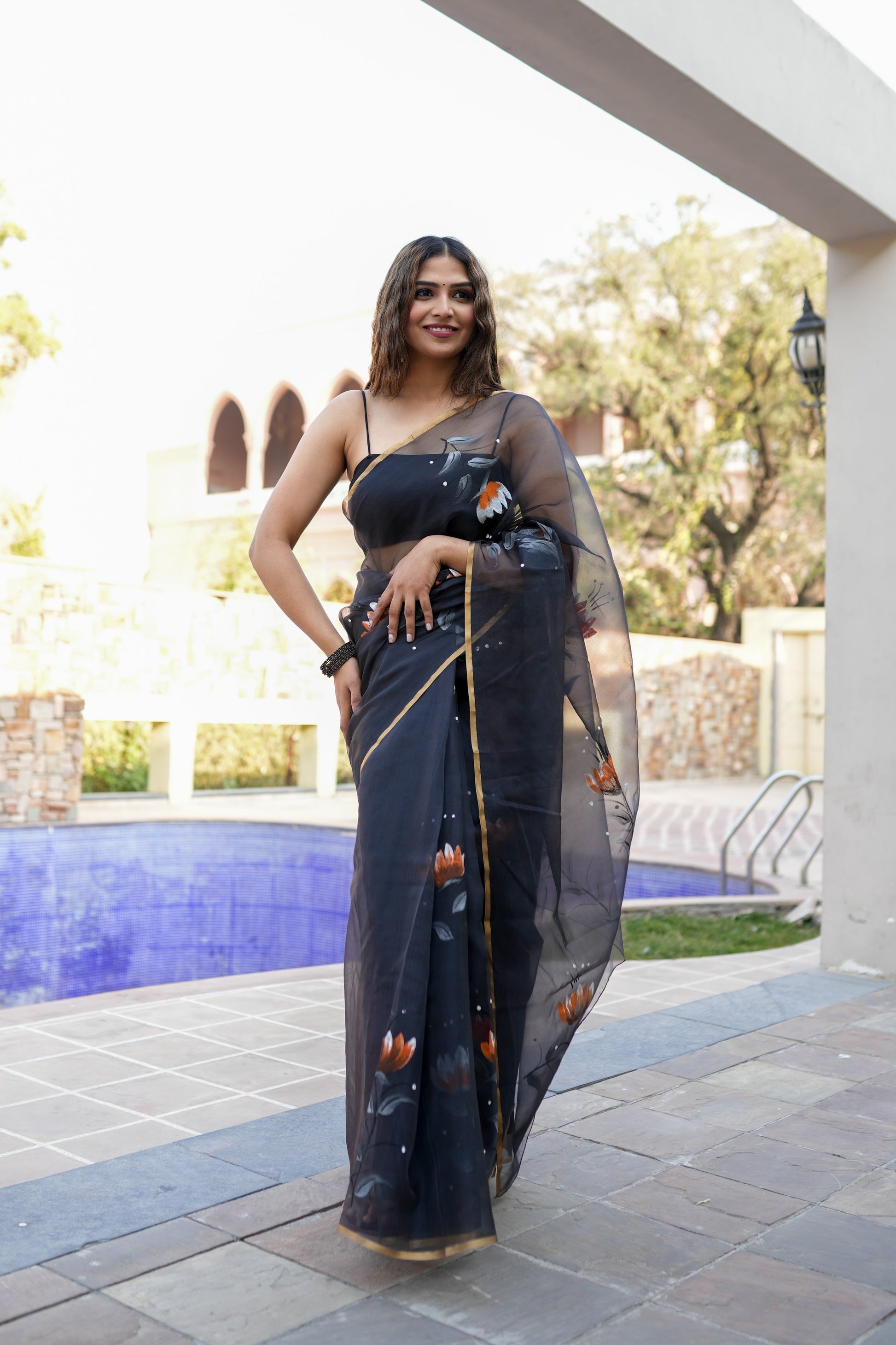 Elegant designer party wear saree for women with floral design, perfect for special occasions