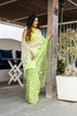 Elegant designer party wear saree in light green with floral embroidery, perfect for festive occasions