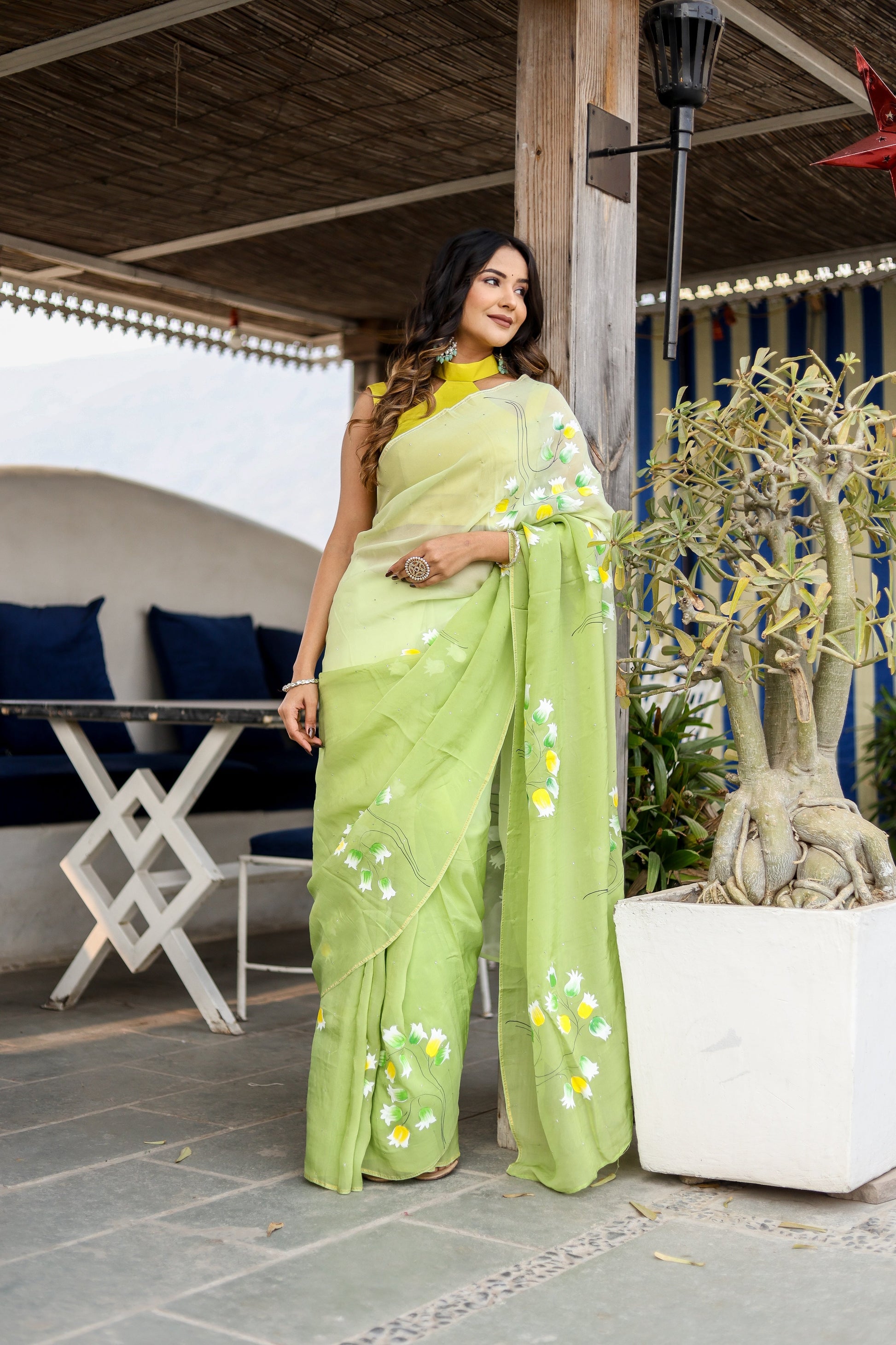 Stunning designer party wear saree in light green with floral embroidery, perfect for festive occasions