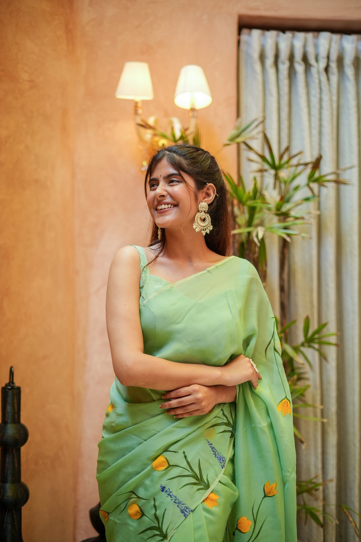 Elegant light green designer saree for women with floral patterns, perfect for festive occasions