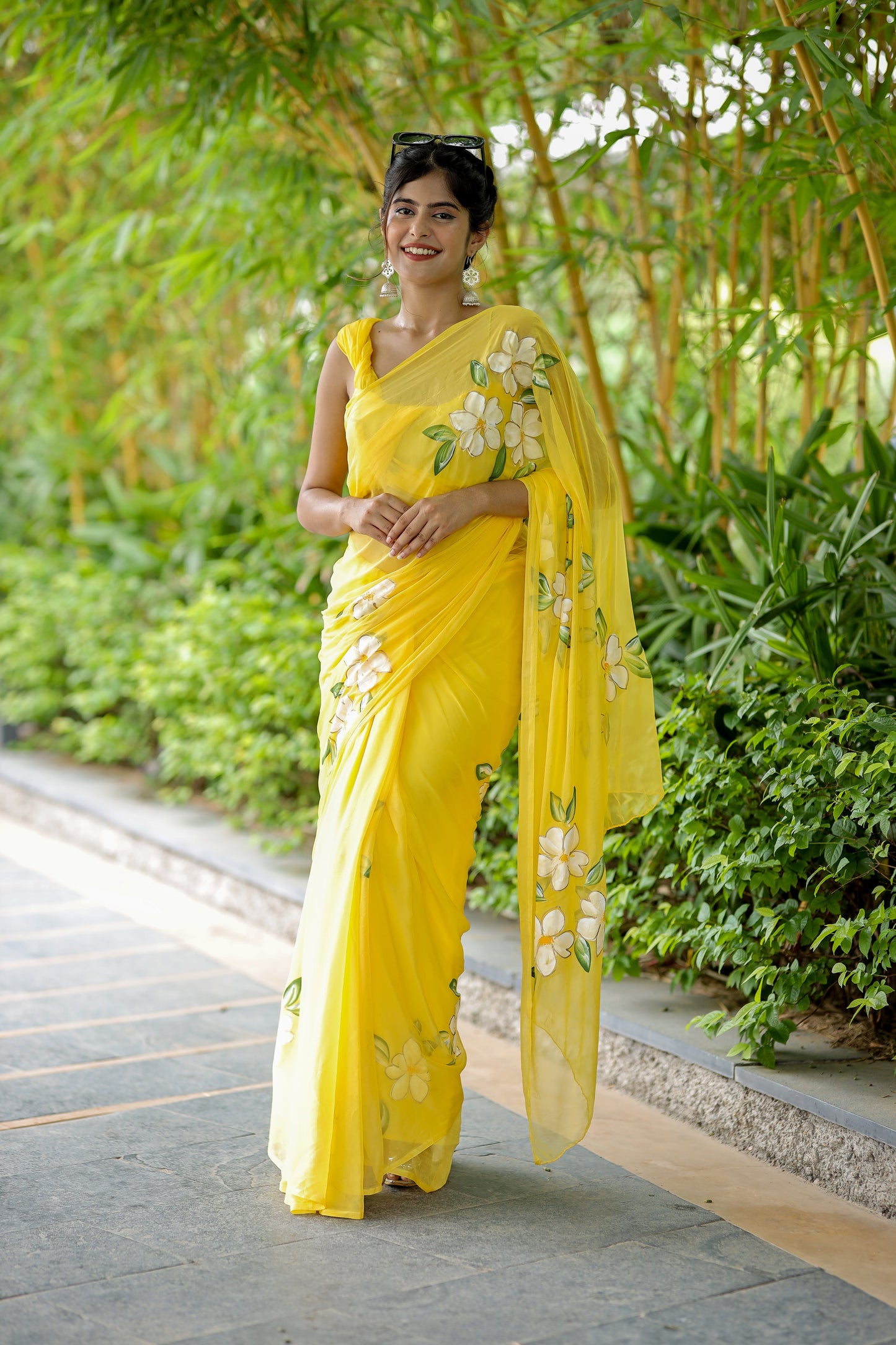 Stylera designer saree with floral art in bright yellow, perfect for festive occasions