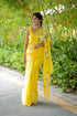 Elegant yellow designer saree with floral art, perfect for festive occasions and celebrations