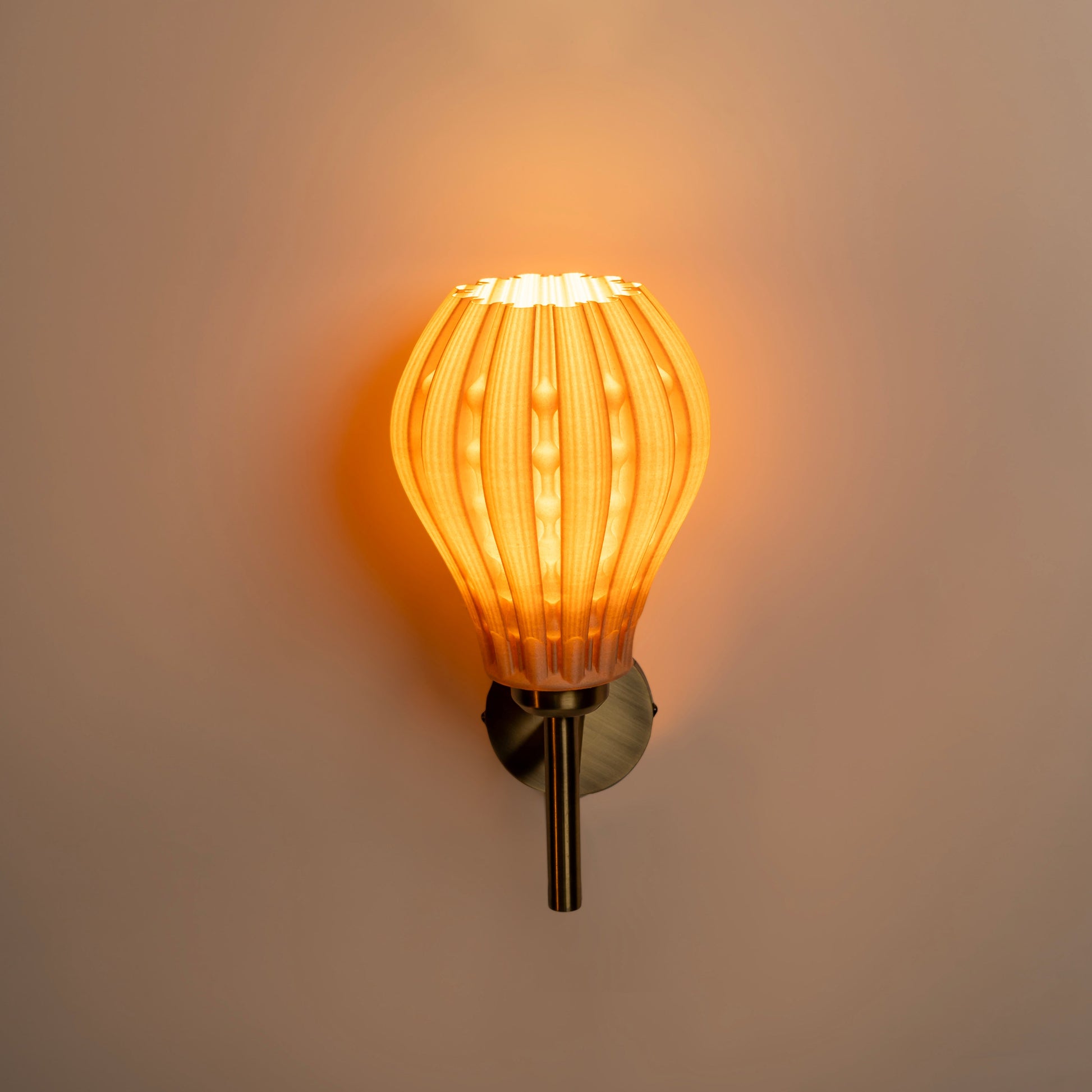 Sozori designer wall lamp for living room featuring an elegant amber glass shade and stylish metal base