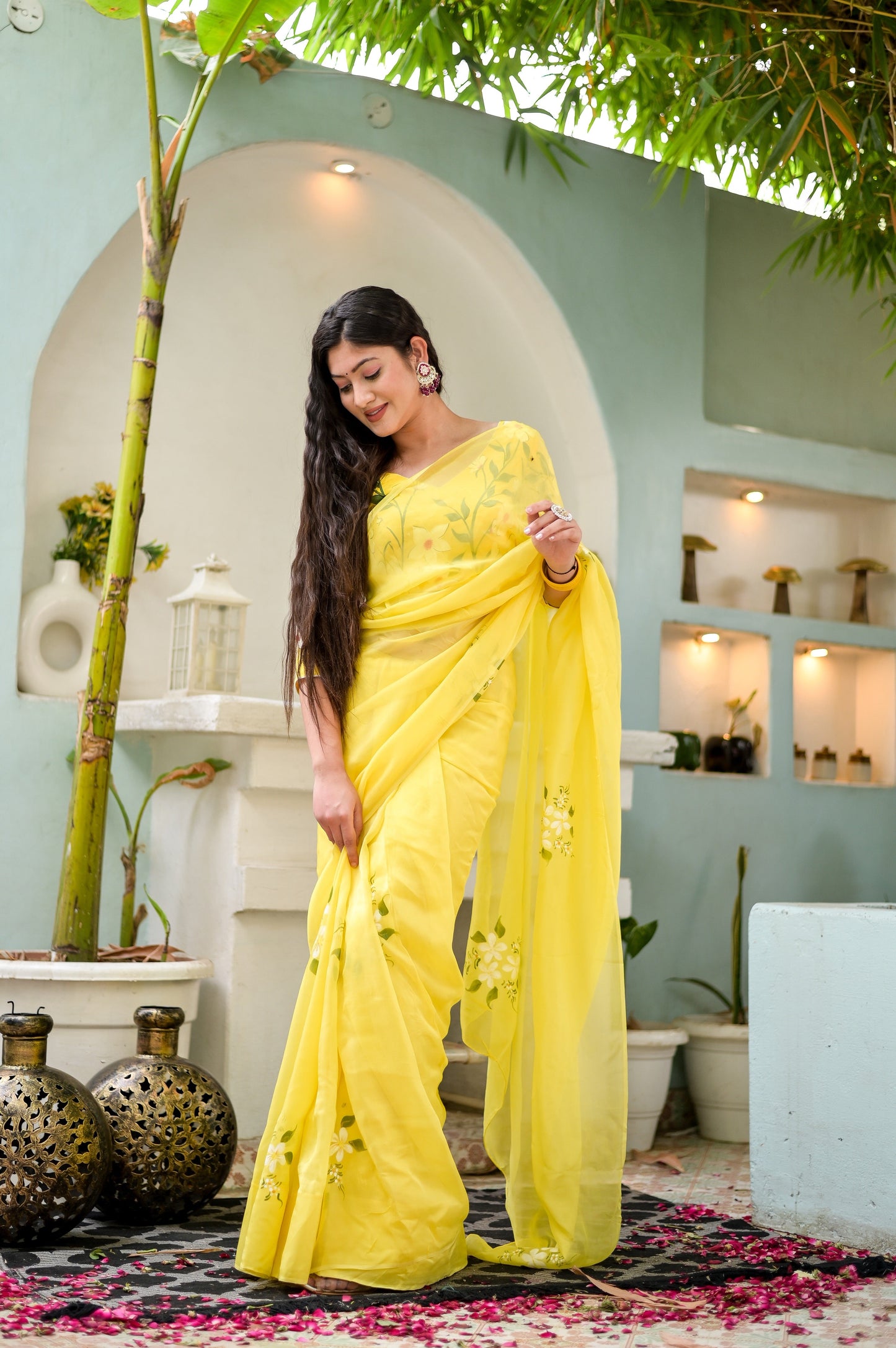 Elegant designer yellow saree hand painted with floral patterns for a stylish ethnic look