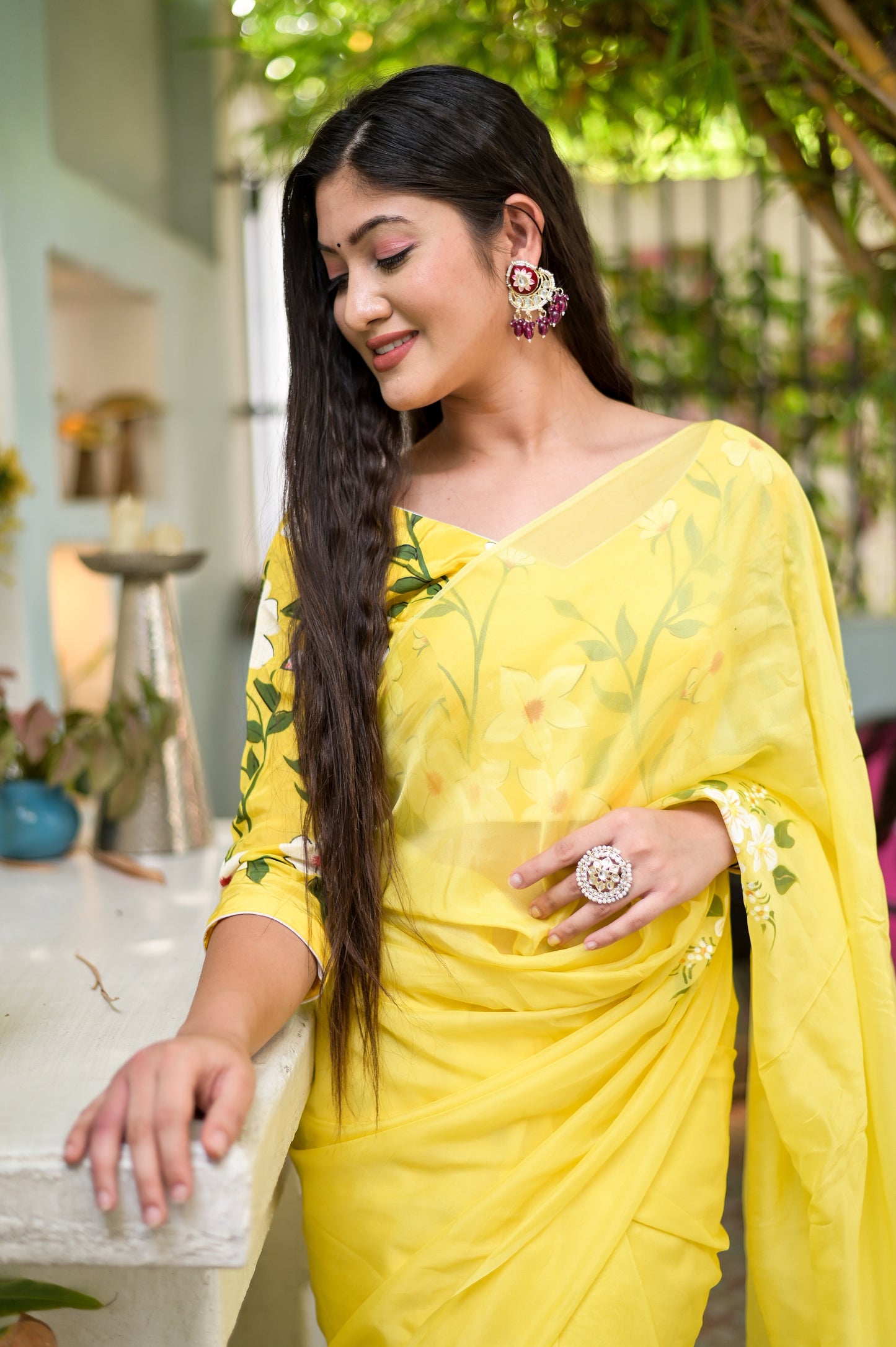 Elegant designer yellow saree hand painted with floral designs, perfect for special occasions